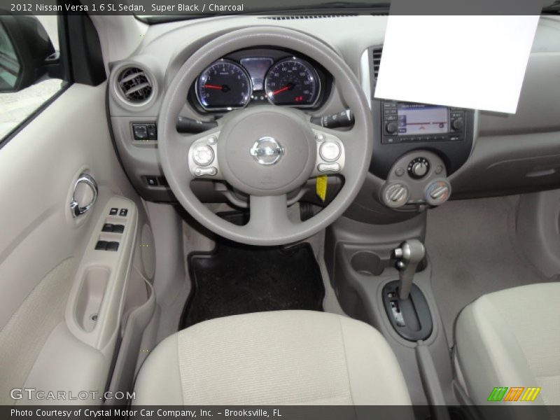 Super Black / Charcoal 2012 Nissan Versa 1.6 SL Sedan