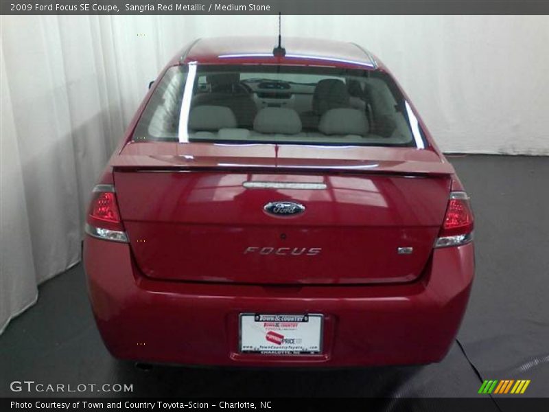 Sangria Red Metallic / Medium Stone 2009 Ford Focus SE Coupe