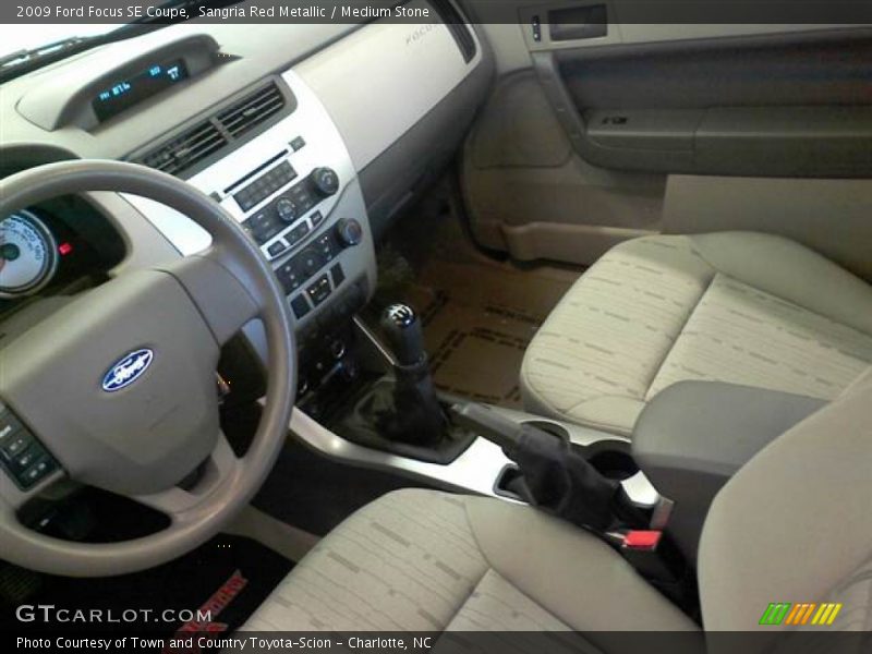 Sangria Red Metallic / Medium Stone 2009 Ford Focus SE Coupe