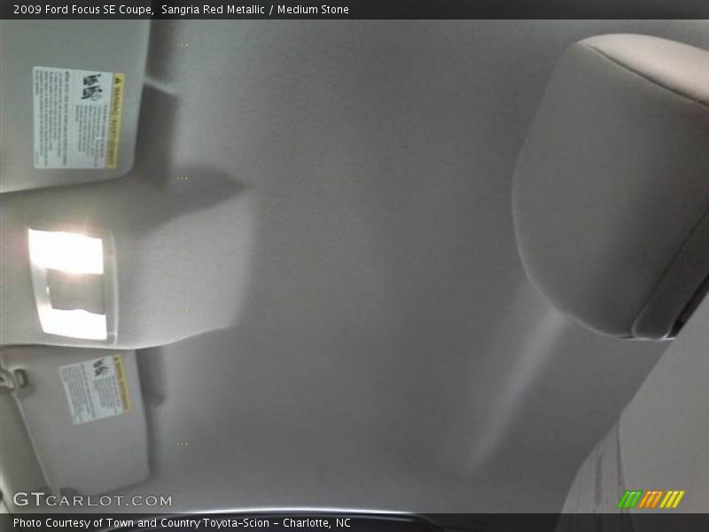 Sangria Red Metallic / Medium Stone 2009 Ford Focus SE Coupe