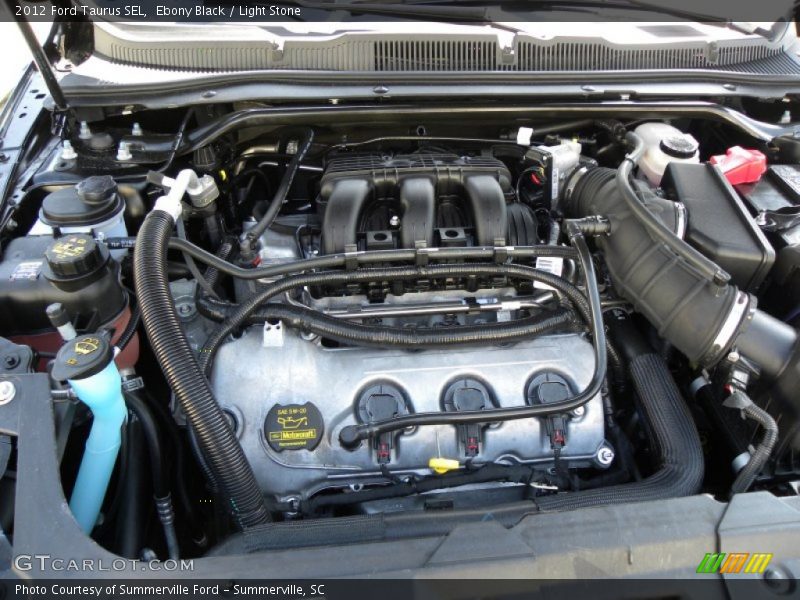 Ebony Black / Light Stone 2012 Ford Taurus SEL