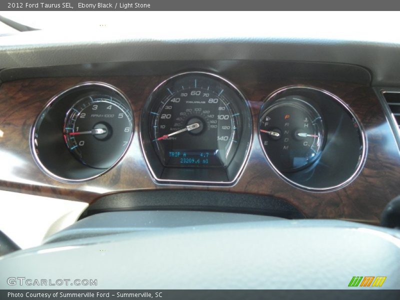 Ebony Black / Light Stone 2012 Ford Taurus SEL