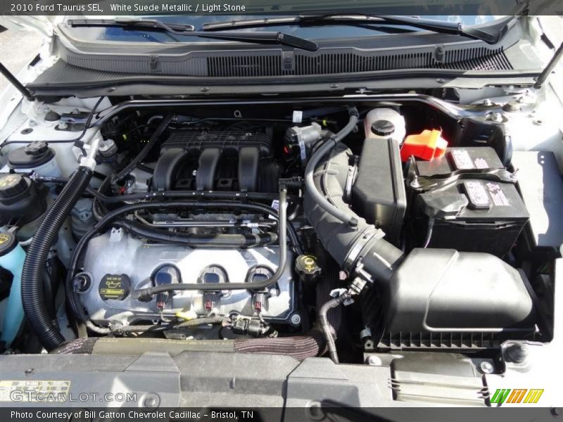 White Suede Metallic / Light Stone 2010 Ford Taurus SEL