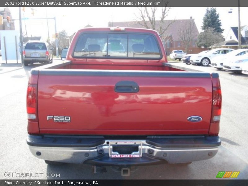 Toreador Red Metallic / Medium Flint 2002 Ford F250 Super Duty XLT SuperCab 4x4