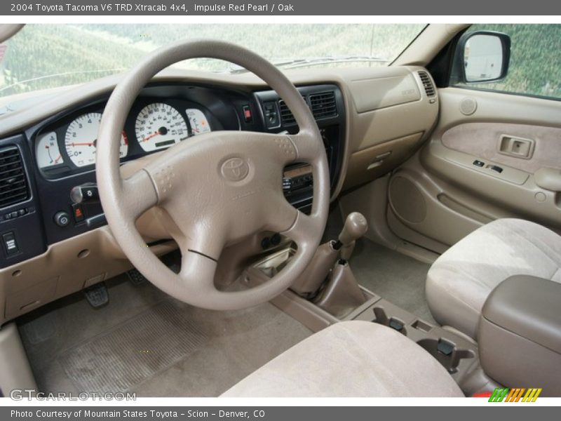 Impulse Red Pearl / Oak 2004 Toyota Tacoma V6 TRD Xtracab 4x4