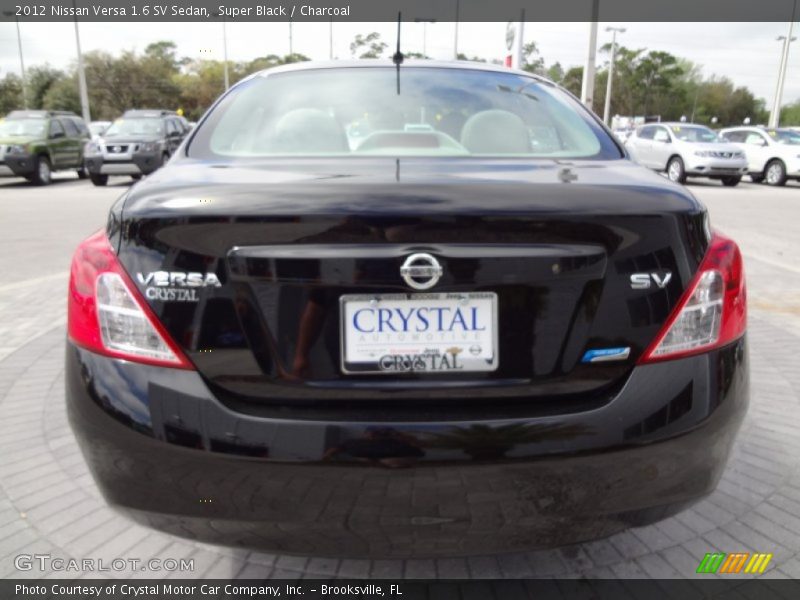 Super Black / Charcoal 2012 Nissan Versa 1.6 SV Sedan