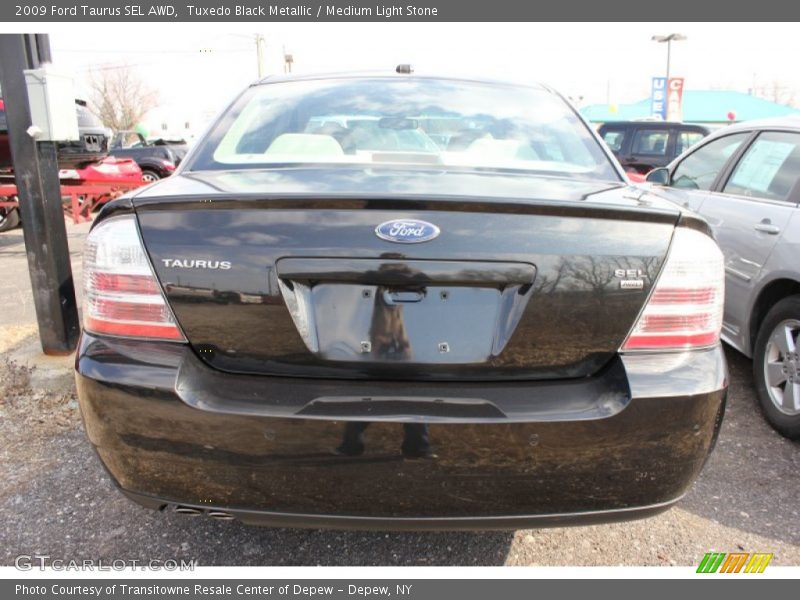 Tuxedo Black Metallic / Medium Light Stone 2009 Ford Taurus SEL AWD