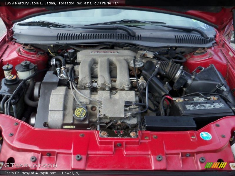 Toreador Red Metallic / Prairie Tan 1999 Mercury Sable LS Sedan