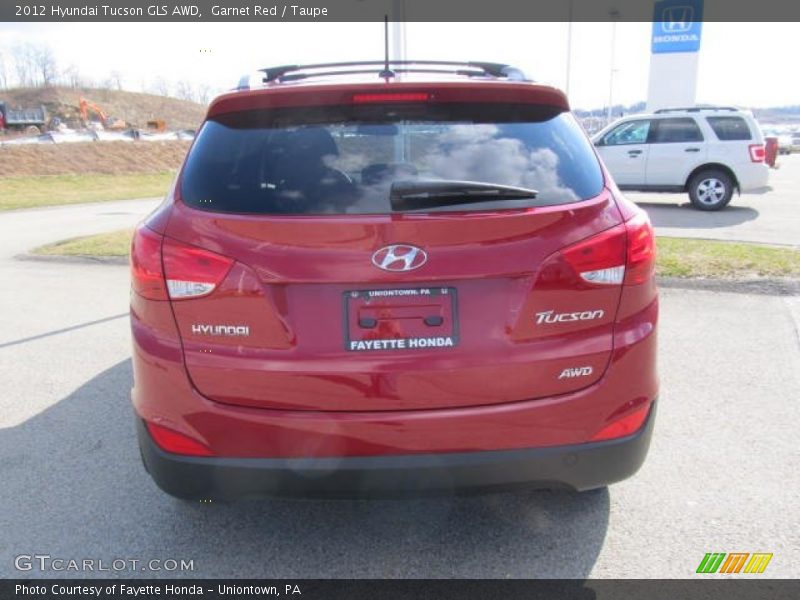 Garnet Red / Taupe 2012 Hyundai Tucson GLS AWD