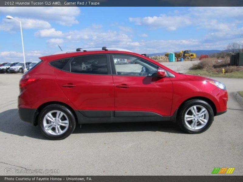 Garnet Red / Taupe 2012 Hyundai Tucson GLS AWD