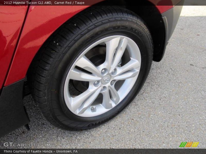 Garnet Red / Taupe 2012 Hyundai Tucson GLS AWD