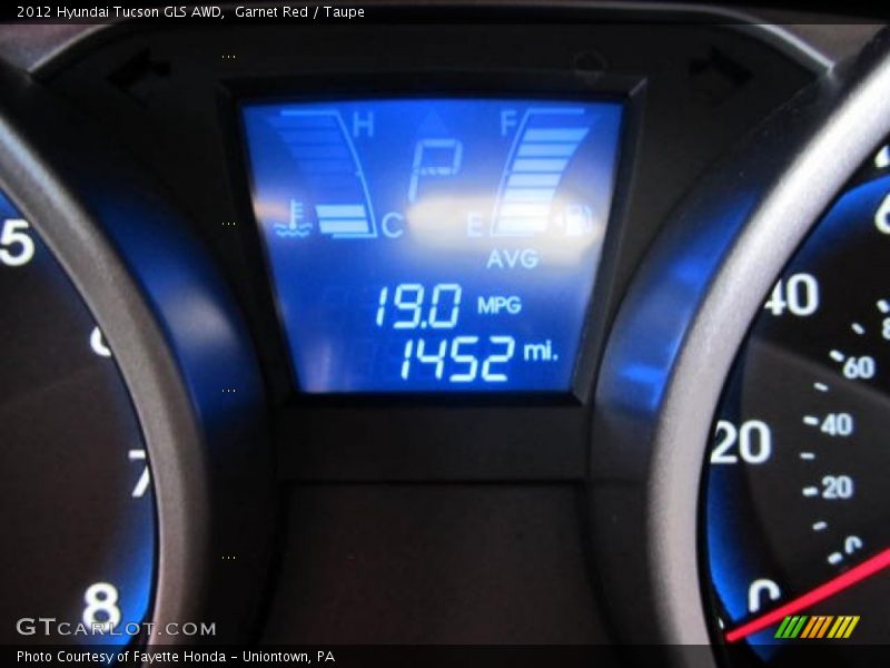 Garnet Red / Taupe 2012 Hyundai Tucson GLS AWD