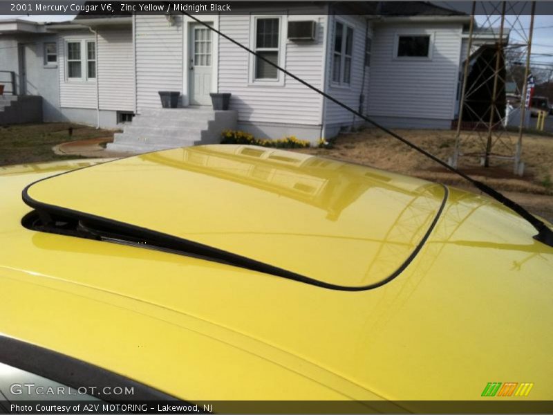 Zinc Yellow / Midnight Black 2001 Mercury Cougar V6