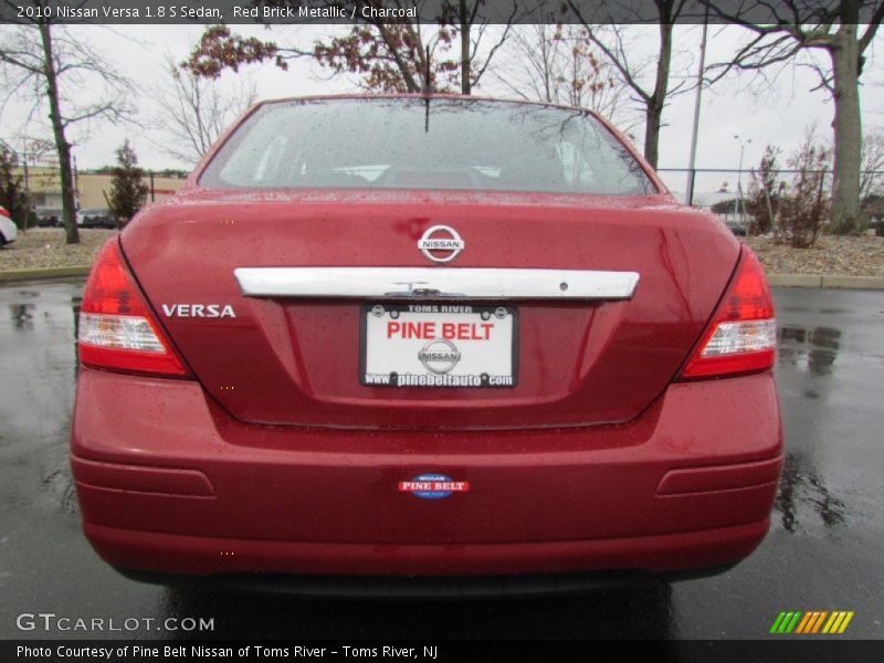 Red Brick Metallic / Charcoal 2010 Nissan Versa 1.8 S Sedan