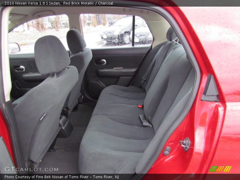 Red Brick Metallic / Charcoal 2010 Nissan Versa 1.8 S Sedan