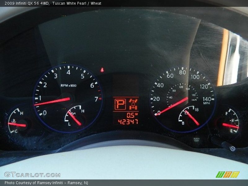 Tuscan White Pearl / Wheat 2009 Infiniti QX 56 4WD