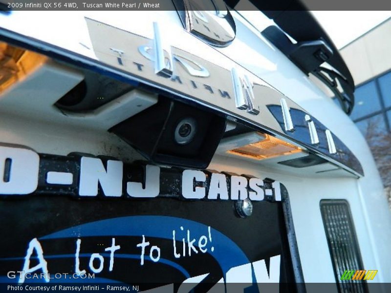Tuscan White Pearl / Wheat 2009 Infiniti QX 56 4WD
