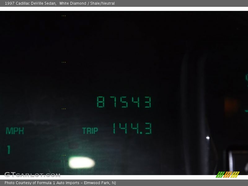 White Diamond / Shale/Neutral 1997 Cadillac DeVille Sedan