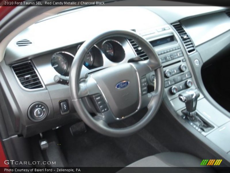 Red Candy Metallic / Charcoal Black 2010 Ford Taurus SEL