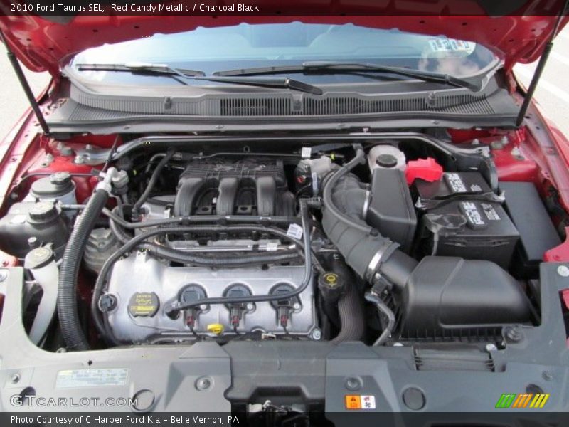 Red Candy Metallic / Charcoal Black 2010 Ford Taurus SEL