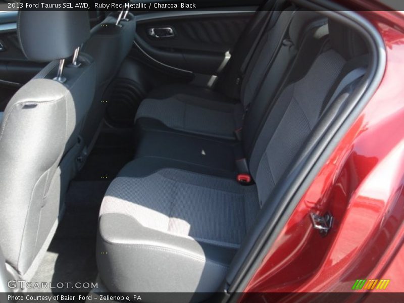 Ruby Red Metallic / Charcoal Black 2013 Ford Taurus SEL AWD