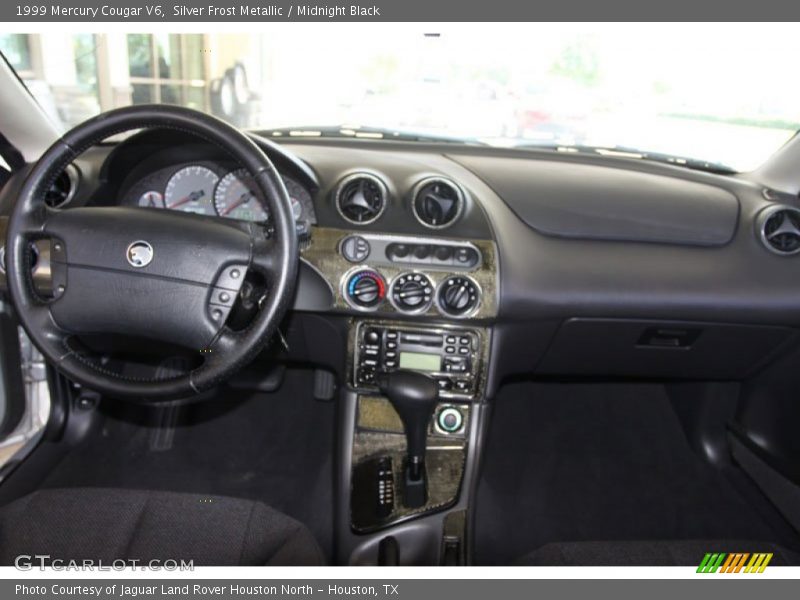 Silver Frost Metallic / Midnight Black 1999 Mercury Cougar V6