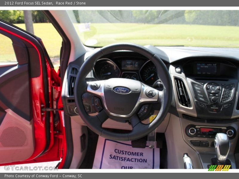Race Red / Stone 2012 Ford Focus SEL Sedan
