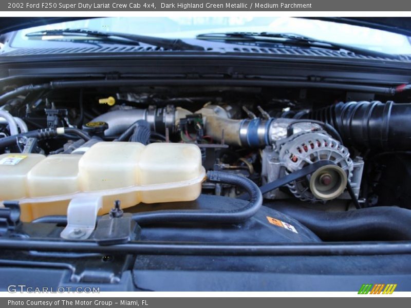 Dark Highland Green Metallic / Medium Parchment 2002 Ford F250 Super Duty Lariat Crew Cab 4x4