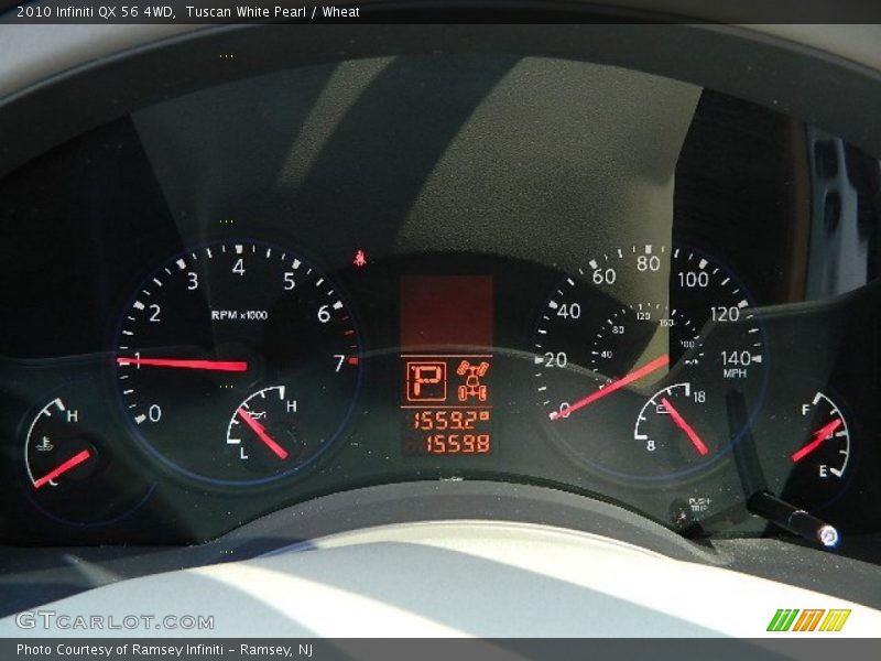Tuscan White Pearl / Wheat 2010 Infiniti QX 56 4WD