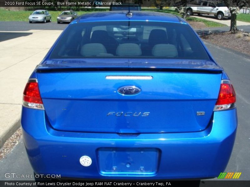 Blue Flame Metallic / Charcoal Black 2010 Ford Focus SE Coupe