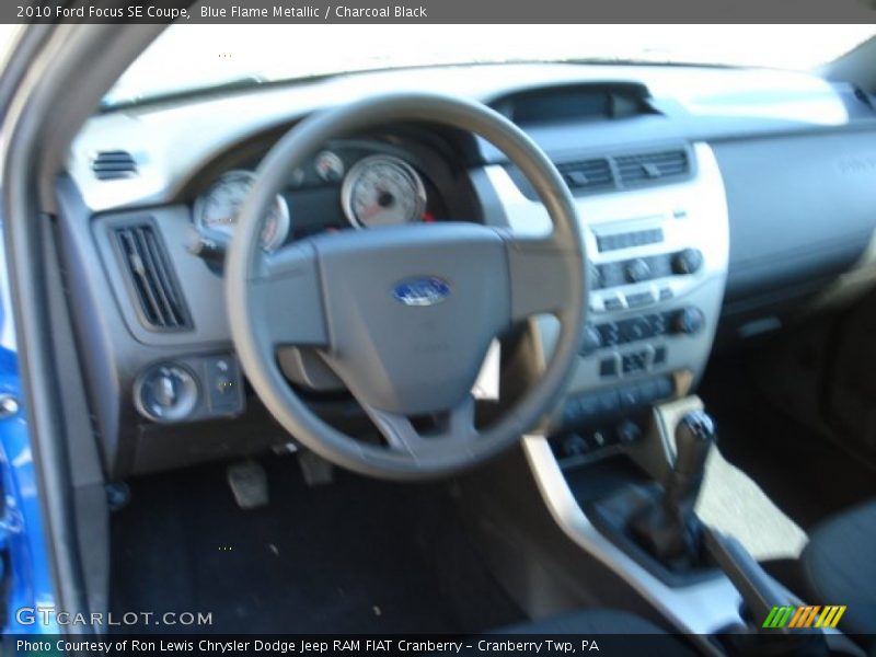Blue Flame Metallic / Charcoal Black 2010 Ford Focus SE Coupe