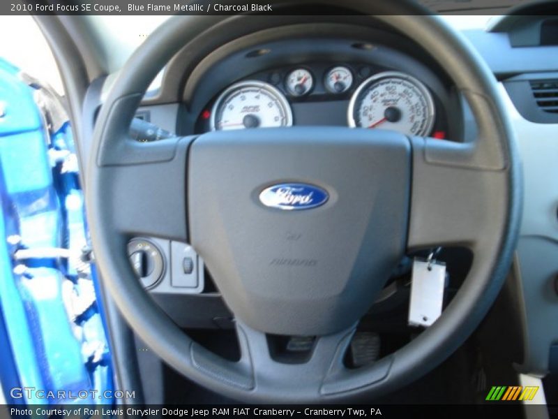 Blue Flame Metallic / Charcoal Black 2010 Ford Focus SE Coupe