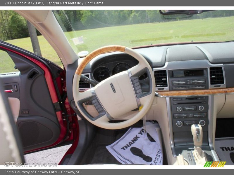 Sangria Red Metallic / Light Camel 2010 Lincoln MKZ FWD