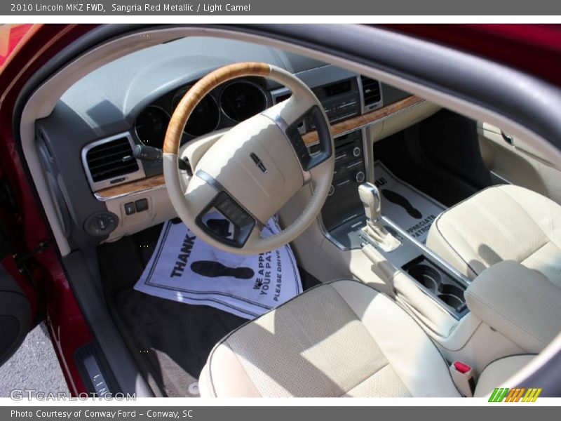 Sangria Red Metallic / Light Camel 2010 Lincoln MKZ FWD