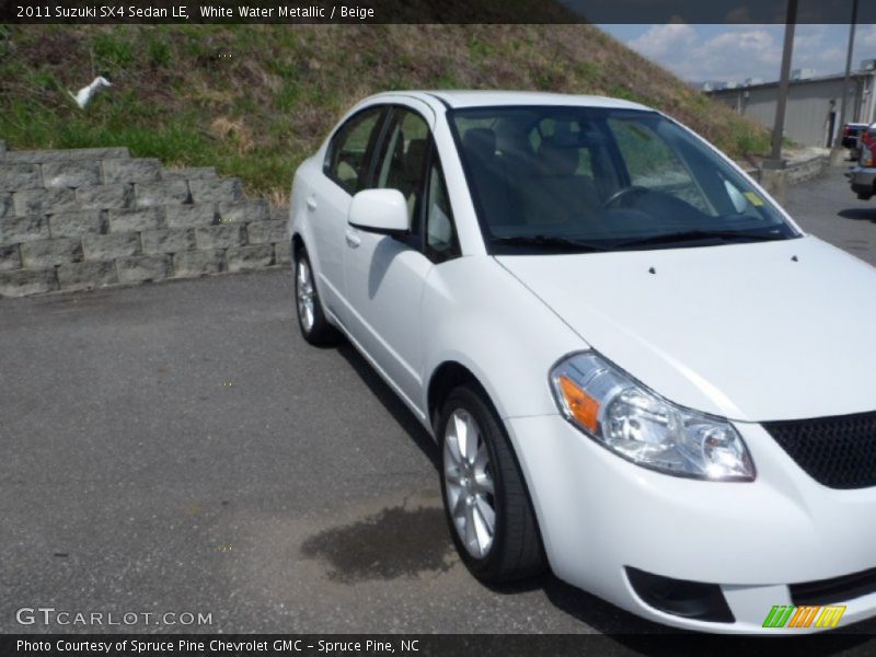 White Water Metallic / Beige 2011 Suzuki SX4 Sedan LE