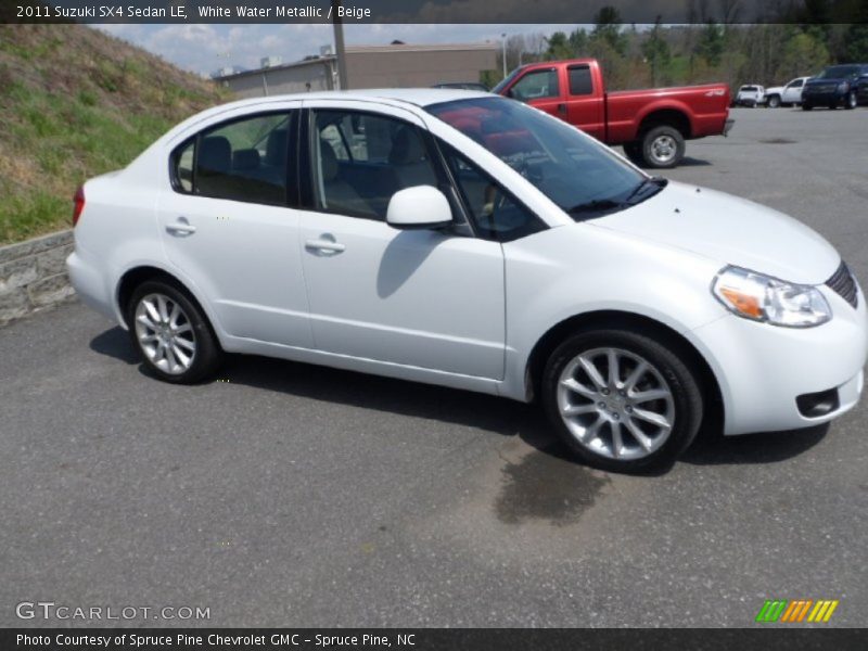 White Water Metallic / Beige 2011 Suzuki SX4 Sedan LE
