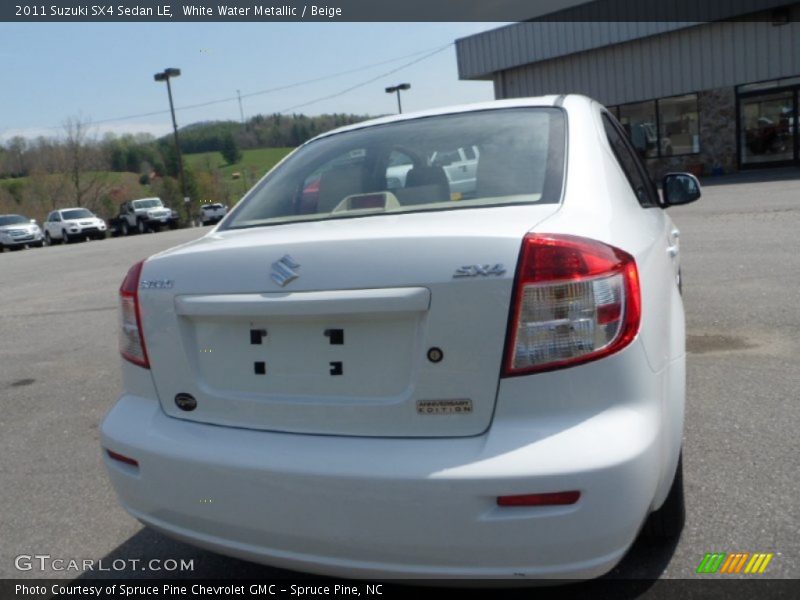 White Water Metallic / Beige 2011 Suzuki SX4 Sedan LE