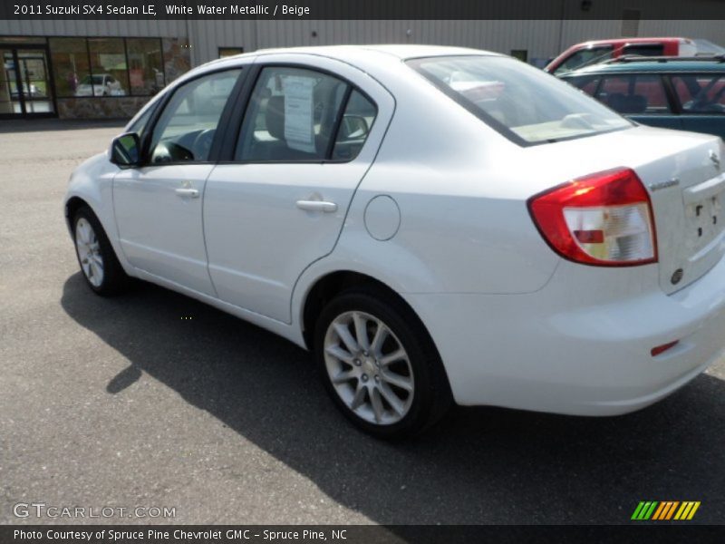 White Water Metallic / Beige 2011 Suzuki SX4 Sedan LE