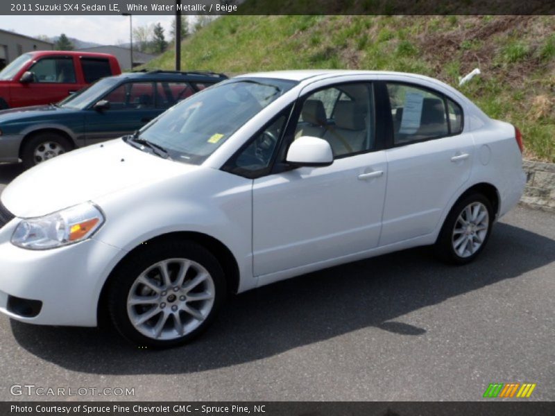 White Water Metallic / Beige 2011 Suzuki SX4 Sedan LE