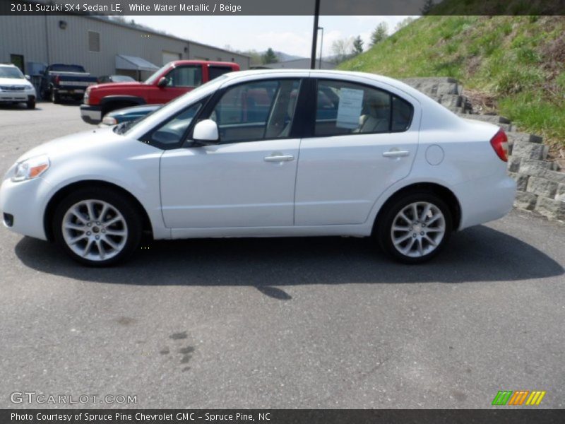 White Water Metallic / Beige 2011 Suzuki SX4 Sedan LE