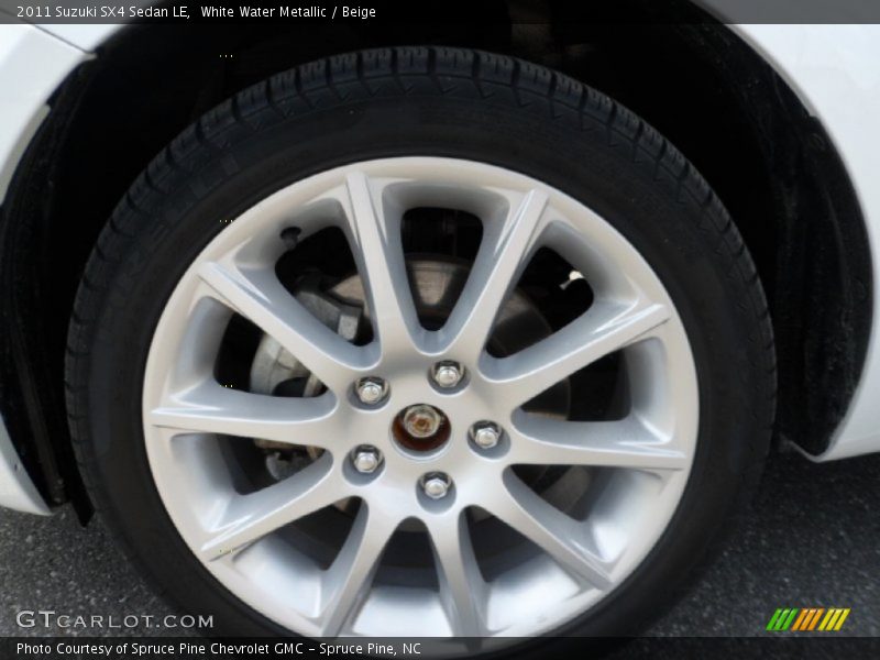 White Water Metallic / Beige 2011 Suzuki SX4 Sedan LE