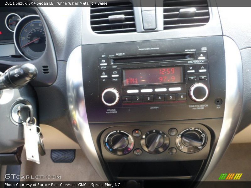 White Water Metallic / Beige 2011 Suzuki SX4 Sedan LE