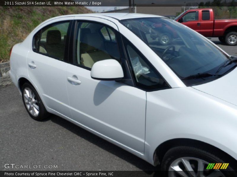 White Water Metallic / Beige 2011 Suzuki SX4 Sedan LE