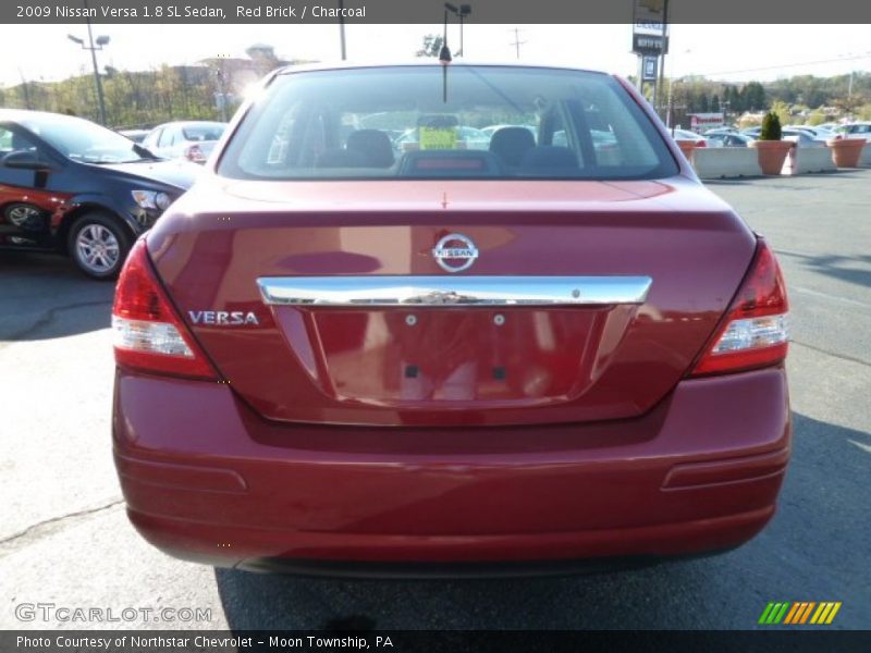 Red Brick / Charcoal 2009 Nissan Versa 1.8 SL Sedan