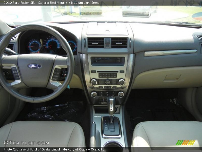 Sangria Red Metallic / Medium Light Stone 2010 Ford Fusion SEL