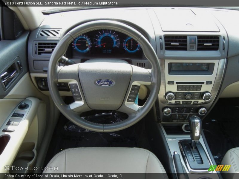 Sangria Red Metallic / Medium Light Stone 2010 Ford Fusion SEL