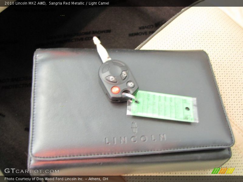 Sangria Red Metallic / Light Camel 2010 Lincoln MKZ AWD