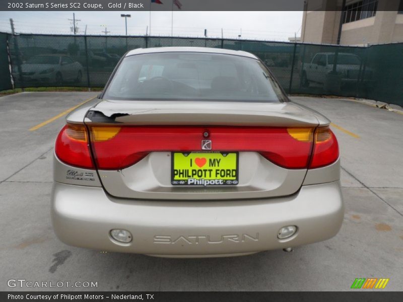 Gold / Black 2002 Saturn S Series SC2 Coupe