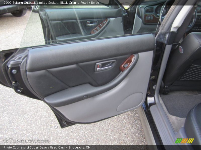 Black Granite Pearl / Beige 2002 Subaru Outback Limited Sedan