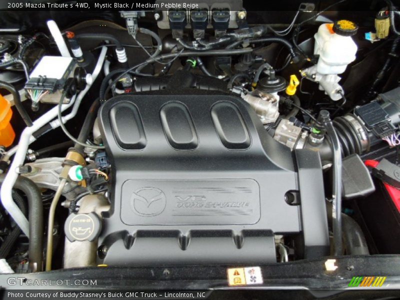 Mystic Black / Medium Pebble Beige 2005 Mazda Tribute s 4WD